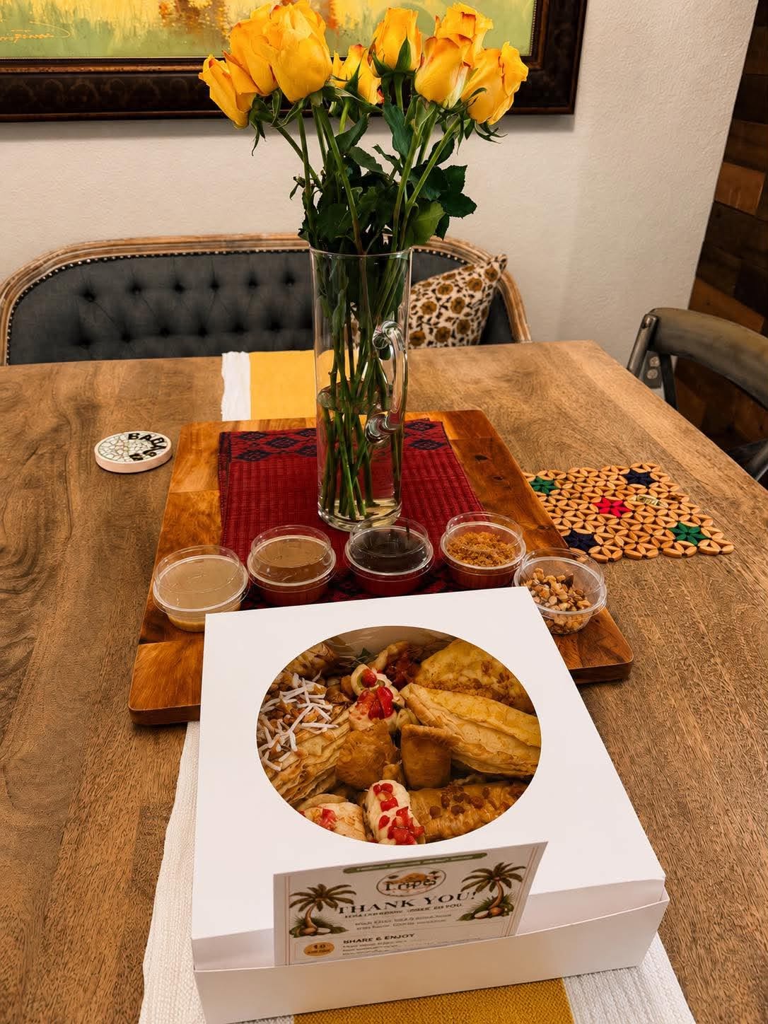 Packaged LOCO Crêpes party box with sauces, toppings, and a thank-you card